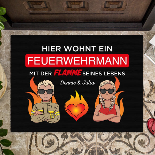 "A firefighter lives here with the flame of his life" with name - Personalized doormat