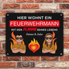 Here lives a fireman with the flame of his life with name - Personalized door sign